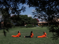 Nepalese people are practicing Yoga at an open ground in Bhaktapur, Nepal, on June 21, 2024, on the occasion of International Yoga Day. (