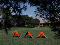 Nepalese people are practicing Yoga at an open ground in Bhaktapur, Nepal, on June 21, 2024, on the occasion of International Yoga Day. (