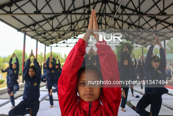 Cadets from the National Cadet Corps (NCC) are performing yoga on International Day of Yoga at Jammu Kashmir Light Infantry Regimental Cente...