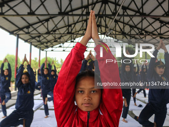 Cadets from the National Cadet Corps (NCC) are performing yoga on International Day of Yoga at Jammu Kashmir Light Infantry Regimental Cente...