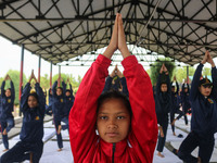 Cadets from the National Cadet Corps (NCC) are performing yoga on International Day of Yoga at Jammu Kashmir Light Infantry Regimental Cente...