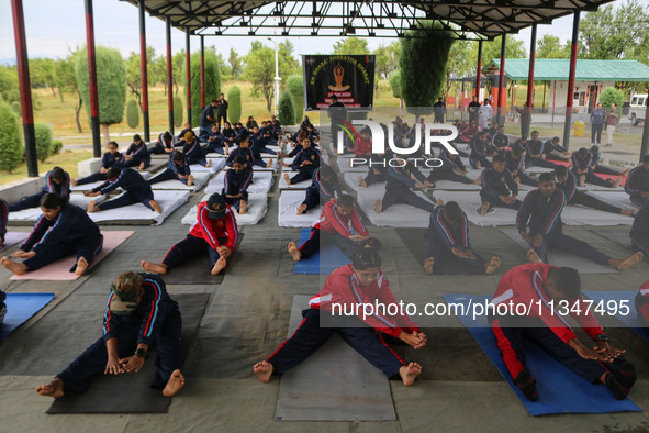 Cadets from the National Cadet Corps (NCC) are performing yoga on International Day of Yoga at Jammu Kashmir Light Infantry Regimental Cente...