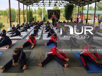 Cadets from the National Cadet Corps (NCC) are performing yoga on International Day of Yoga at Jammu Kashmir Light Infantry Regimental Cente...