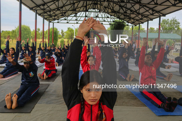 Cadets from the National Cadet Corps (NCC) are performing yoga on International Day of Yoga at Jammu Kashmir Light Infantry Regimental Cente...