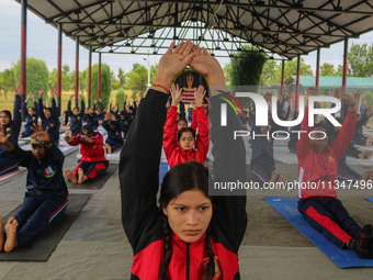 Cadets from the National Cadet Corps (NCC) are performing yoga on International Day of Yoga at Jammu Kashmir Light Infantry Regimental Cente...