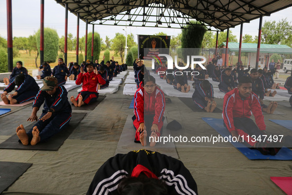 Cadets from the National Cadet Corps (NCC) are performing yoga on International Day of Yoga at Jammu Kashmir Light Infantry Regimental Cente...