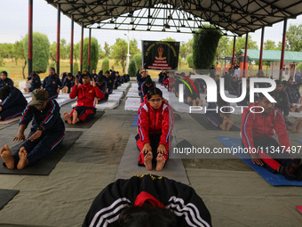 Cadets from the National Cadet Corps (NCC) are performing yoga on International Day of Yoga at Jammu Kashmir Light Infantry Regimental Cente...