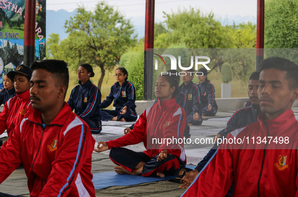 Cadets from the National Cadet Corps (NCC) are performing yoga on International Day of Yoga at Jammu Kashmir Light Infantry Regimental Cente...