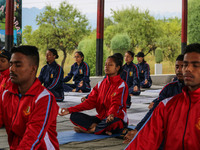 Cadets from the National Cadet Corps (NCC) are performing yoga on International Day of Yoga at Jammu Kashmir Light Infantry Regimental Cente...