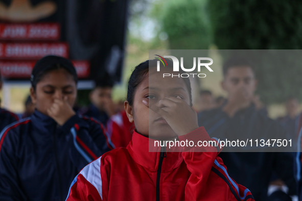 A cadet of the National Cadet Corps (NCC) is performing yoga on International Day of Yoga at Jammu Kashmir Light Infantry Regimental Center...