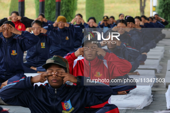 Cadets from the National Cadet Corps (NCC) are performing yoga on International Day of Yoga at Jammu Kashmir Light Infantry Regimental Cente...