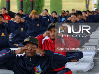 Cadets from the National Cadet Corps (NCC) are performing yoga on International Day of Yoga at Jammu Kashmir Light Infantry Regimental Cente...