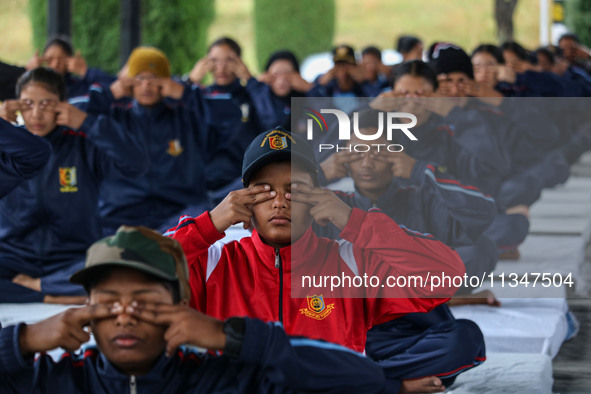 Cadets from the National Cadet Corps (NCC) are performing yoga on International Day of Yoga at Jammu Kashmir Light Infantry Regimental Cente...