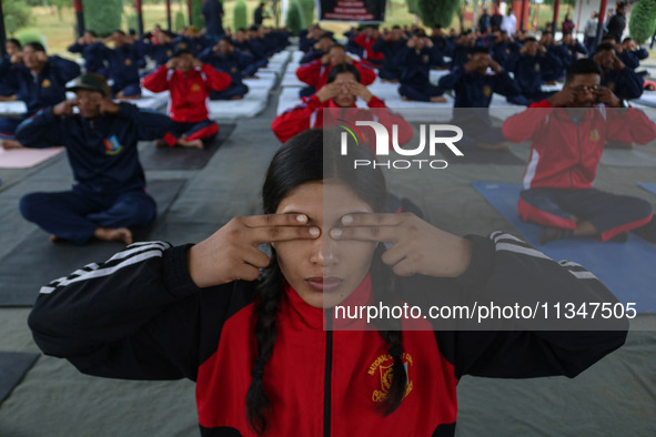 Cadets from the National Cadet Corps (NCC) are performing yoga on International Day of Yoga at Jammu Kashmir Light Infantry Regimental Cente...