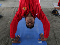 A cadet of the National Cadet Corps (NCC) is performing yoga on International Day of Yoga at Jammu Kashmir Light Infantry Regimental Center...