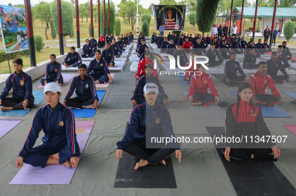 Cadets from the National Cadet Corps (NCC) are performing yoga on International Day of Yoga at Jammu Kashmir Light Infantry Regimental Cente...