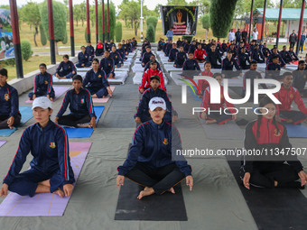 Cadets from the National Cadet Corps (NCC) are performing yoga on International Day of Yoga at Jammu Kashmir Light Infantry Regimental Cente...