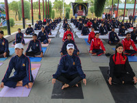 Cadets from the National Cadet Corps (NCC) are performing yoga on International Day of Yoga at Jammu Kashmir Light Infantry Regimental Cente...