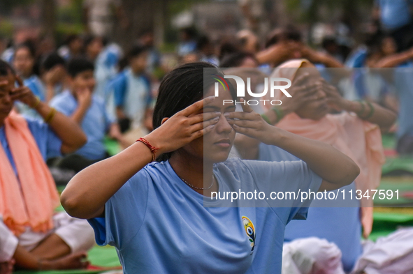 People are performing Yoga on the occasion of International Yoga Day, on the lawns of Kartavya Path, in front of India Gate, in New Delhi, I...