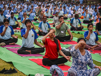 People are performing Yoga on the occasion of International Yoga Day, on the lawns of Kartavya Path, in front of India Gate, in New Delhi, I...