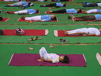 People are performing Yoga on the occasion of International Yoga Day, on the lawns of Kartavya Path, in front of India Gate, in New Delhi, I...