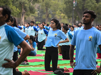 People are performing Yoga on the occasion of International Yoga Day, on the lawns of Kartavya Path, in front of India Gate, in New Delhi, I...