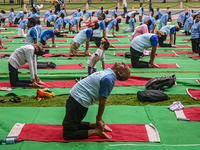 People are performing Yoga on the occasion of International Yoga Day, on the lawns of Kartavya Path, in front of India Gate, in New Delhi, I...