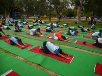 People are performing Yoga on the occasion of International Yoga Day, on the lawns of Kartavya Path, in front of India Gate, in New Delhi, I...