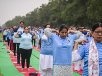 People are performing Yoga on the occasion of International Yoga Day, on the lawns of Kartavya Path, in front of India Gate, in New Delhi, I...