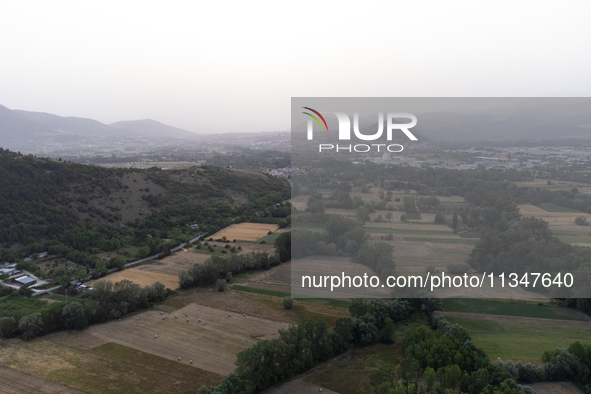 A hazy landscape is seen in an aerial drone view in L’Aquila, Italy, on June 20th, 2024. High atmospheric pressure from Africa (african anti...