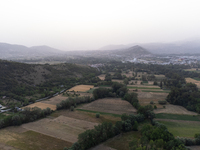 A hazy landscape is seen in an aerial drone view in L’Aquila, Italy, on June 20th, 2024. High atmospheric pressure from Africa (african anti...