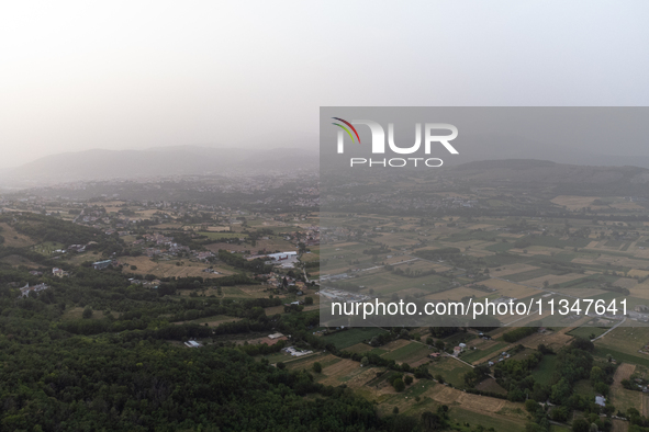 A hazy landscape is seen in an aerial drone view in L’Aquila, Italy, on June 20th, 2024. High atmospheric pressure from Africa (african anti...