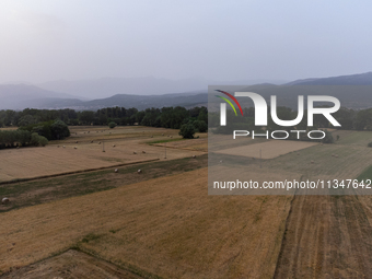 A hazy landscape is seen in an aerial drone view in L’Aquila, Italy, on June 20th, 2024. High atmospheric pressure from Africa (african anti...