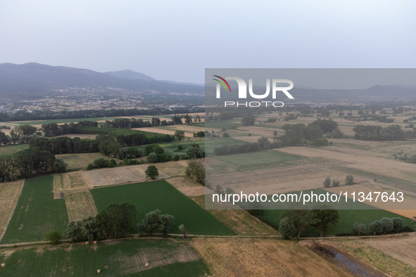 A hazy landscape is seen in an aerial drone view in L’Aquila, Italy, on June 20th, 2024. High atmospheric pressure from Africa (african anti...