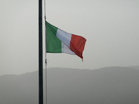 An italian flag and a hazy landscape on background are seen in L’Aquila, Italy, on June 20th, 2024. High atmospheric pressure from Africa (a...