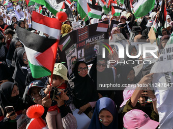 Hundreds of pro-Palestinian activists are taking part in a protest against Israel's attack on Gaza (a refugee camp) in Malang City, East Jav...