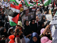 Hundreds of pro-Palestinian activists are taking part in a protest against Israel's attack on Gaza (a refugee camp) in Malang City, East Jav...