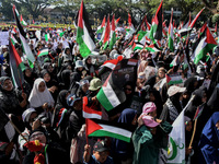 Hundreds of pro-Palestinian activists are taking part in a protest against Israel's attack on Gaza (a refugee camp) in Malang City, East Jav...