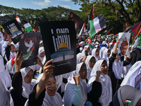 A pro-Palestinian activist is taking part in a protest against Israeli attacks on Gaza and Rafah (refugee camp) with a poster of Benjamin Ne...