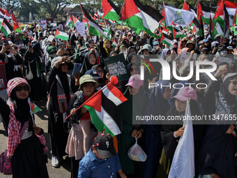 Hundreds of pro-Palestinian activists are taking part in a protest against Israel's attack on Gaza (a refugee camp) in Malang City, East Jav...