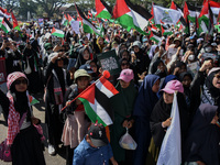 Hundreds of pro-Palestinian activists are taking part in a protest against Israel's attack on Gaza (a refugee camp) in Malang City, East Jav...