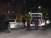 Evidence is being collected at the crime scene. A 50-year-old male victim is being shot multiple times and killed in Chicago, Illinois, Unit...