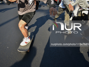 Skaters are taking part in the international world skateboarding day 'Go Skateboarding Day' with a ride around city streets in Malang City,...