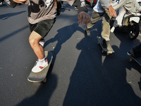 Skaters are taking part in the international world skateboarding day 'Go Skateboarding Day' with a ride around city streets in Malang City,...