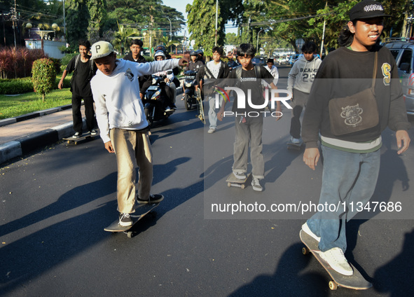 Skaters are taking part in the international world skateboarding day 'Go Skateboarding Day' with a ride around city streets in Malang City,...