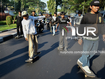 Skaters are taking part in the international world skateboarding day 'Go Skateboarding Day' with a ride around city streets in Malang City,...