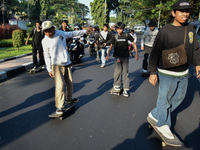 Skaters are taking part in the international world skateboarding day 'Go Skateboarding Day' with a ride around city streets in Malang City,...