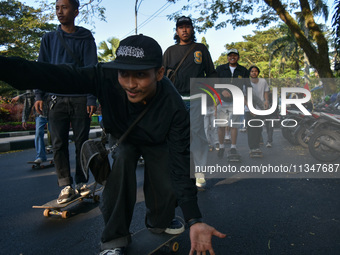 Skaters are taking part in the international world skateboarding day 'Go Skateboarding Day' with a ride around city streets in Malang City,...