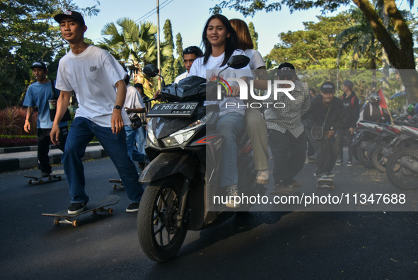 Skaters are taking part in the international world skateboarding day 'Go Skateboarding Day' with a ride around city streets in Malang City,...