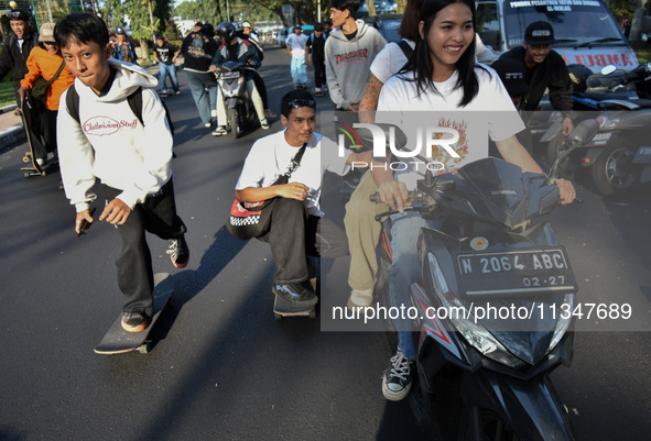 Skaters are taking part in the international world skateboarding day 'Go Skateboarding Day' with a ride around city streets in Malang City,...